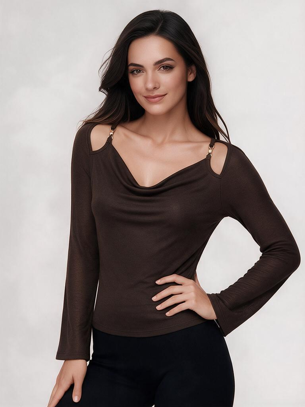 A Fitted Long-sleeved Top With A Flared Neckline And Metallic Shoulder Embellishments.