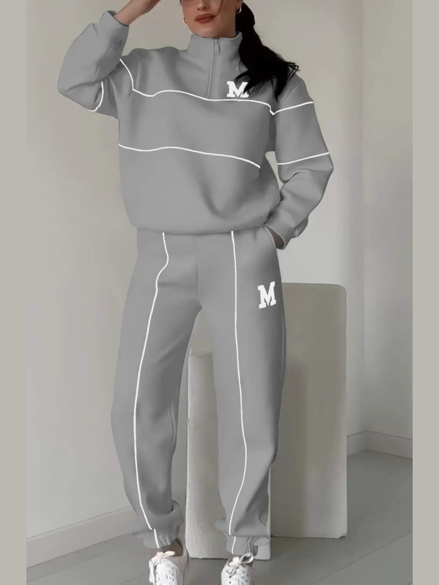 Ensemble deux pièces décontracté : sweat-shirt à manches longues sans capuche et pantalon.