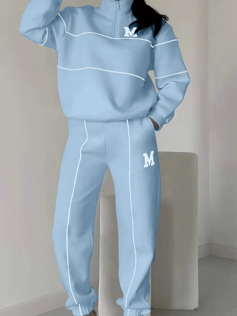 Ensemble deux pièces décontracté : sweat-shirt à manches longues sans capuche et pantalon.