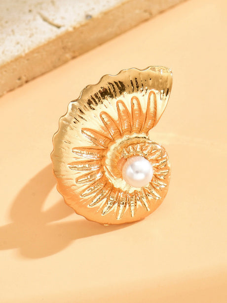 A Ring With An Exaggerated Design Inspired By Conch Shells And Starfish.