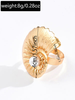 A Ring With An Exaggerated Design Inspired By Conch Shells And Starfish.