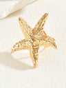 A Ring With An Exaggerated Design Inspired By Conch Shells And Starfish.