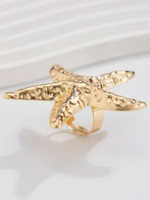 A Ring With An Exaggerated Design Inspired By Conch Shells And Starfish.