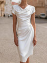 A Midi Dress With A Ruffled Neckline And A Fitted, Bodycon Silhouette.