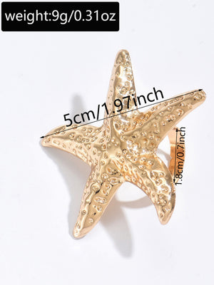 A Ring With An Exaggerated Design Inspired By Conch Shells And Starfish.