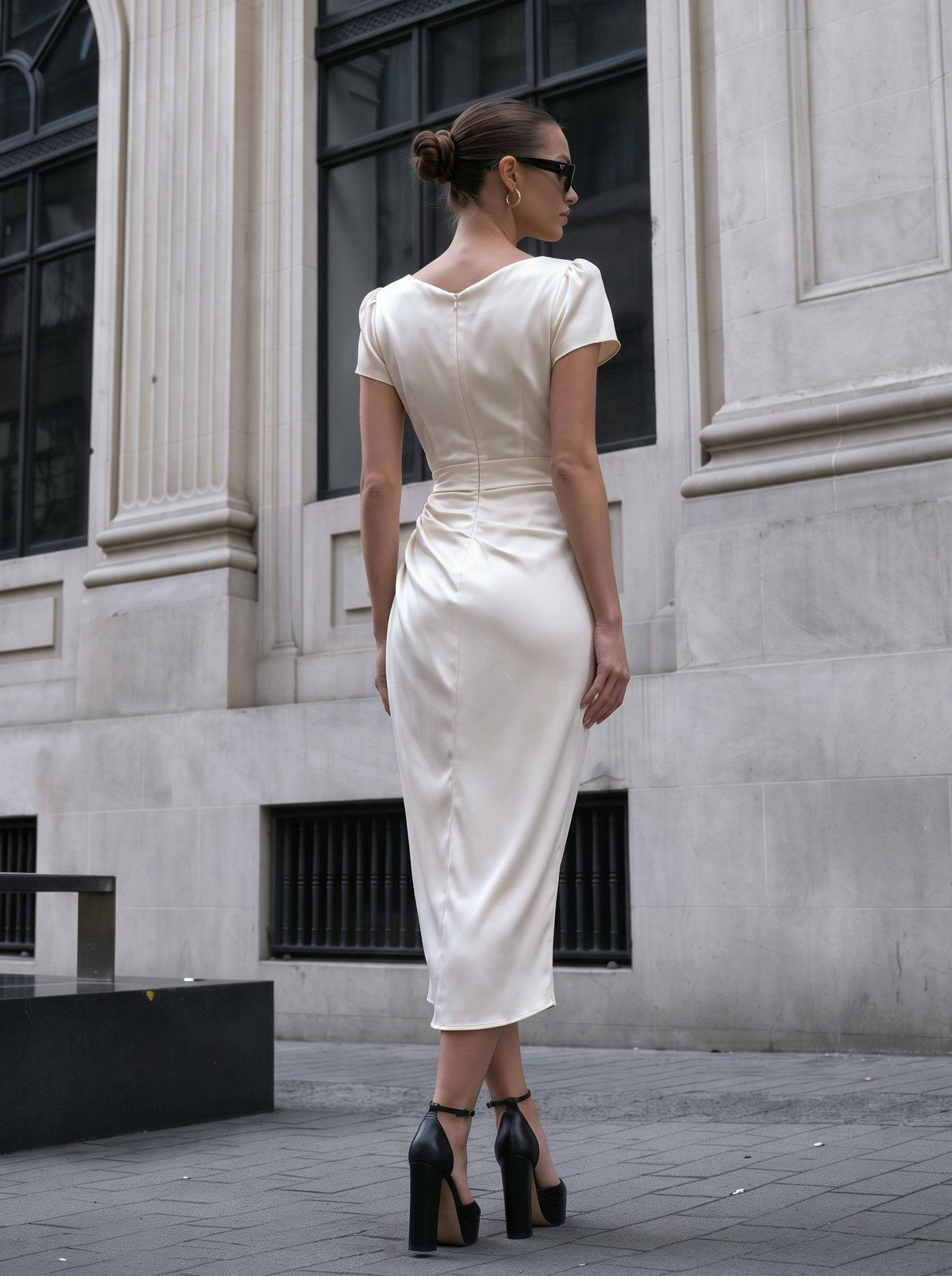 A Midi Dress With A Ruffled Neckline And A Fitted Bodycon Silhouette