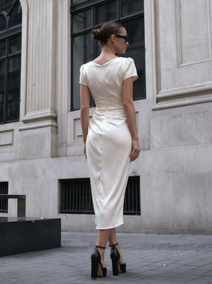 A Midi Dress With A Ruffled Neckline And A Fitted Bodycon Silhouette