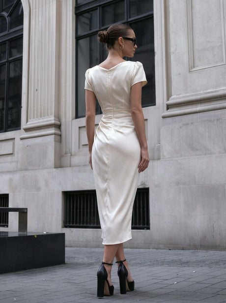 A Midi Dress With A Ruffled Neckline And A Fitted Bodycon Silhouette