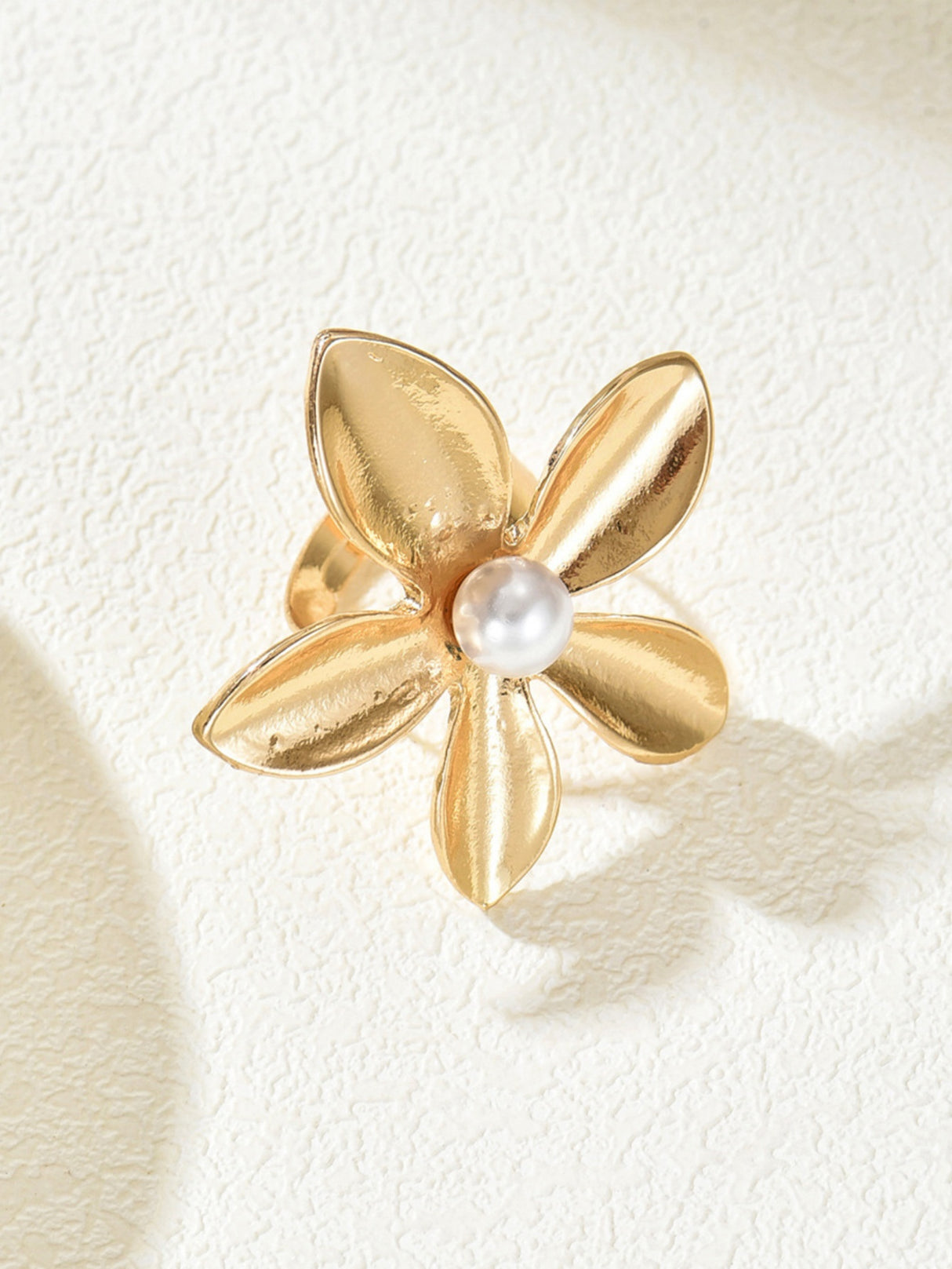 A Ring With An Exaggerated Design Inspired By Conch Shells And Starfish.