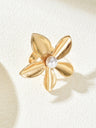 A Ring With An Exaggerated Design Inspired By Conch Shells And Starfish.