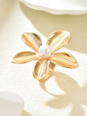 A Ring With An Exaggerated Design Inspired By Conch Shells And Starfish.