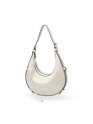 A Small, Sleek Hobo Bag In Vegetable-tanned Top-grain Cowhide, Perfect For Crossbody Or Commuting, Featuring A Summery Crescent Shape, Suitable For Women's Shoulder Or Underarm Wear.