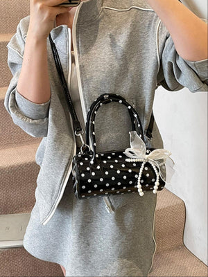 Sac à main cylindrique à pois color-block