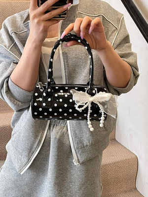 Sac à main cylindrique à pois color-block