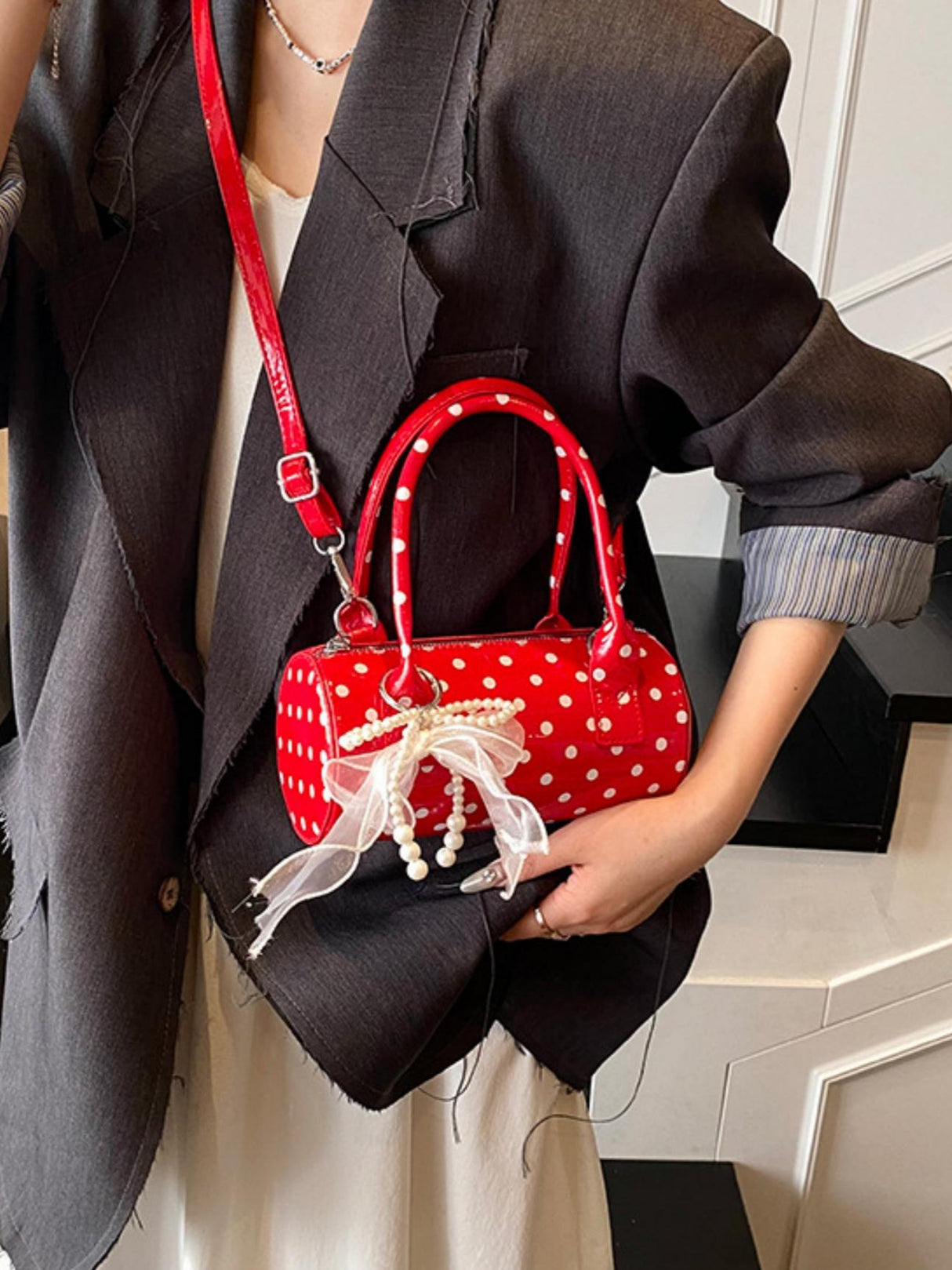 Sac à main cylindrique à pois color-block