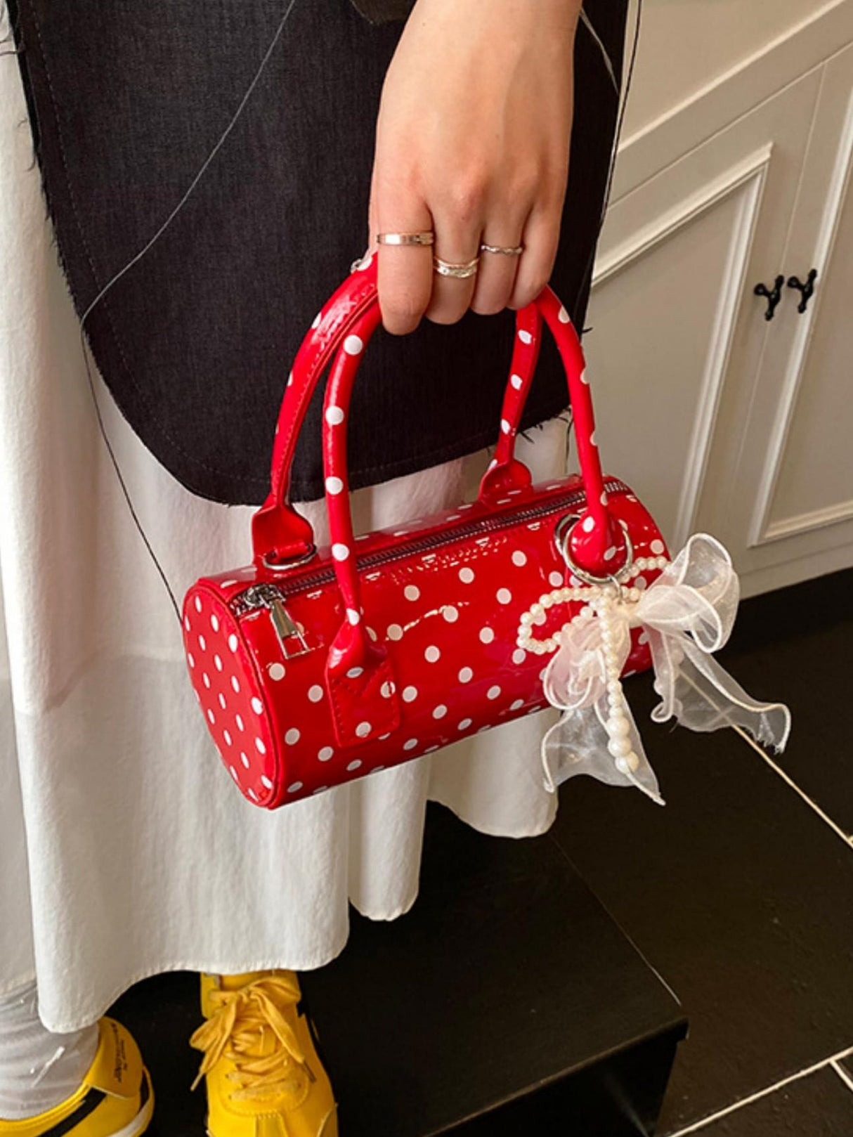 Sac à main cylindrique à pois color-block