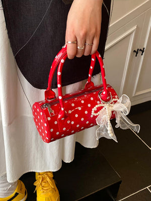 Sac à main cylindrique à pois color-block