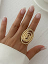 A Ring With An Exaggerated Design Inspired By Conch Shells And Starfish.
