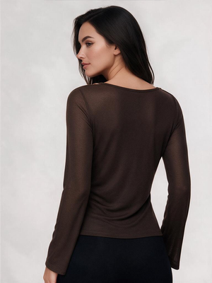 A Fitted Long-sleeved Top With A Flared Neckline And Metallic Shoulder Embellishments.