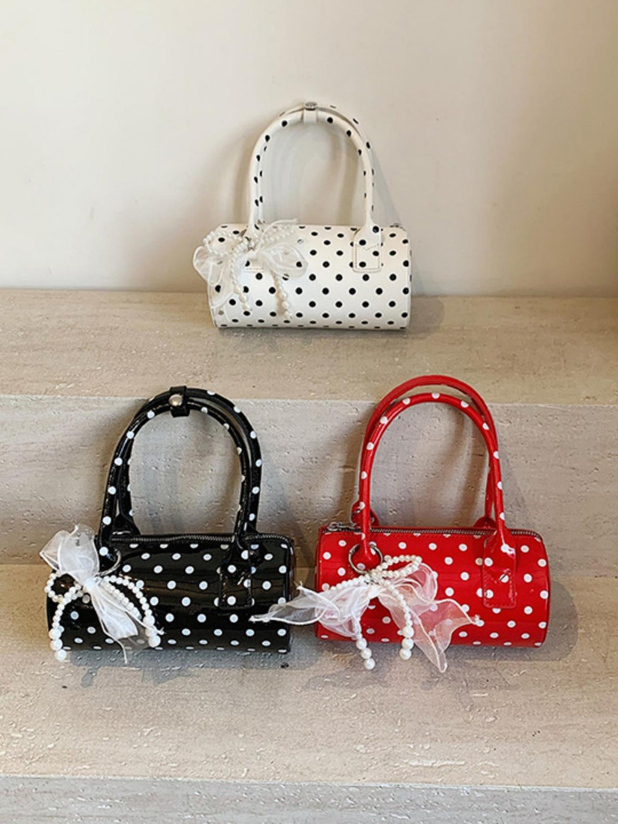 Sac à main cylindrique à pois color-block