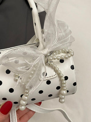 Sac à main cylindrique à pois color-block