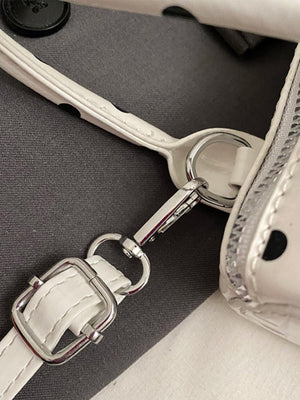 Sac à main cylindrique à pois color-block