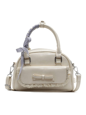 Sac à main orné de dentelle