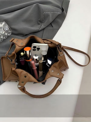 It's A Chain-studded Handbag.