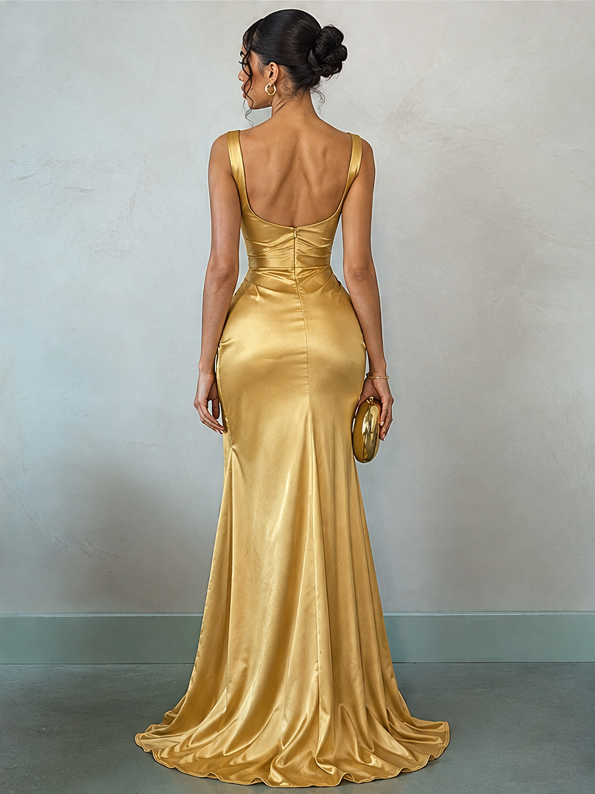 Long Sleeveless Satin Dress With Slits And Pleats At The Hem