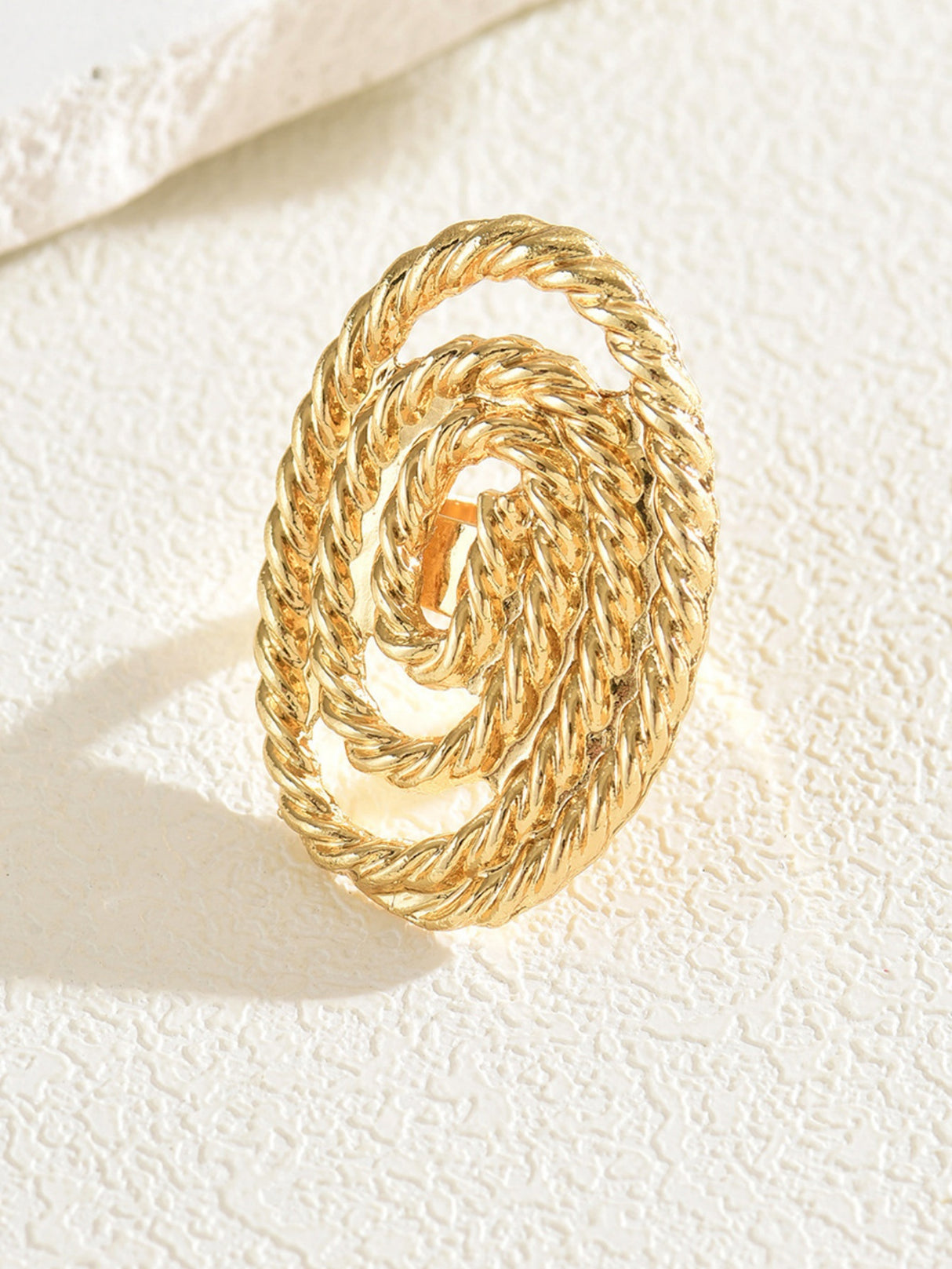 A Ring With An Exaggerated Design Inspired By Conch Shells And Starfish.