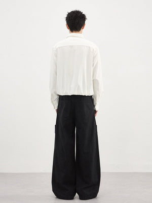 Dekonstruierte Vintage-Cargohose mit doppelseitiger Knopfleiste, weitem Schnitt und geradem Bein.