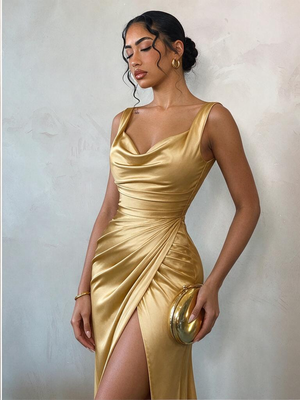 Long Sleeveless Satin Dress With Slits And Pleats At The Hem