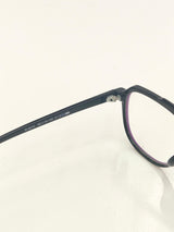 Lunettes à monture noire et bordures vertes