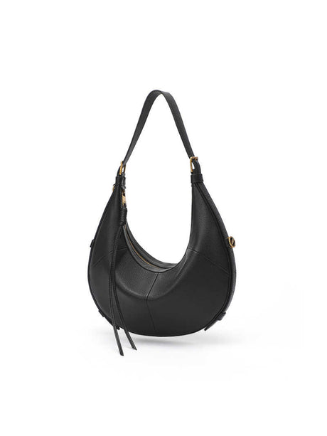 A Small, Sleek Hobo Bag In Vegetable-tanned Top-grain Cowhide, Perfect For Crossbody Or Commuting, Featuring A Summery Crescent Shape, Suitable For Women's Shoulder Or Underarm Wear.