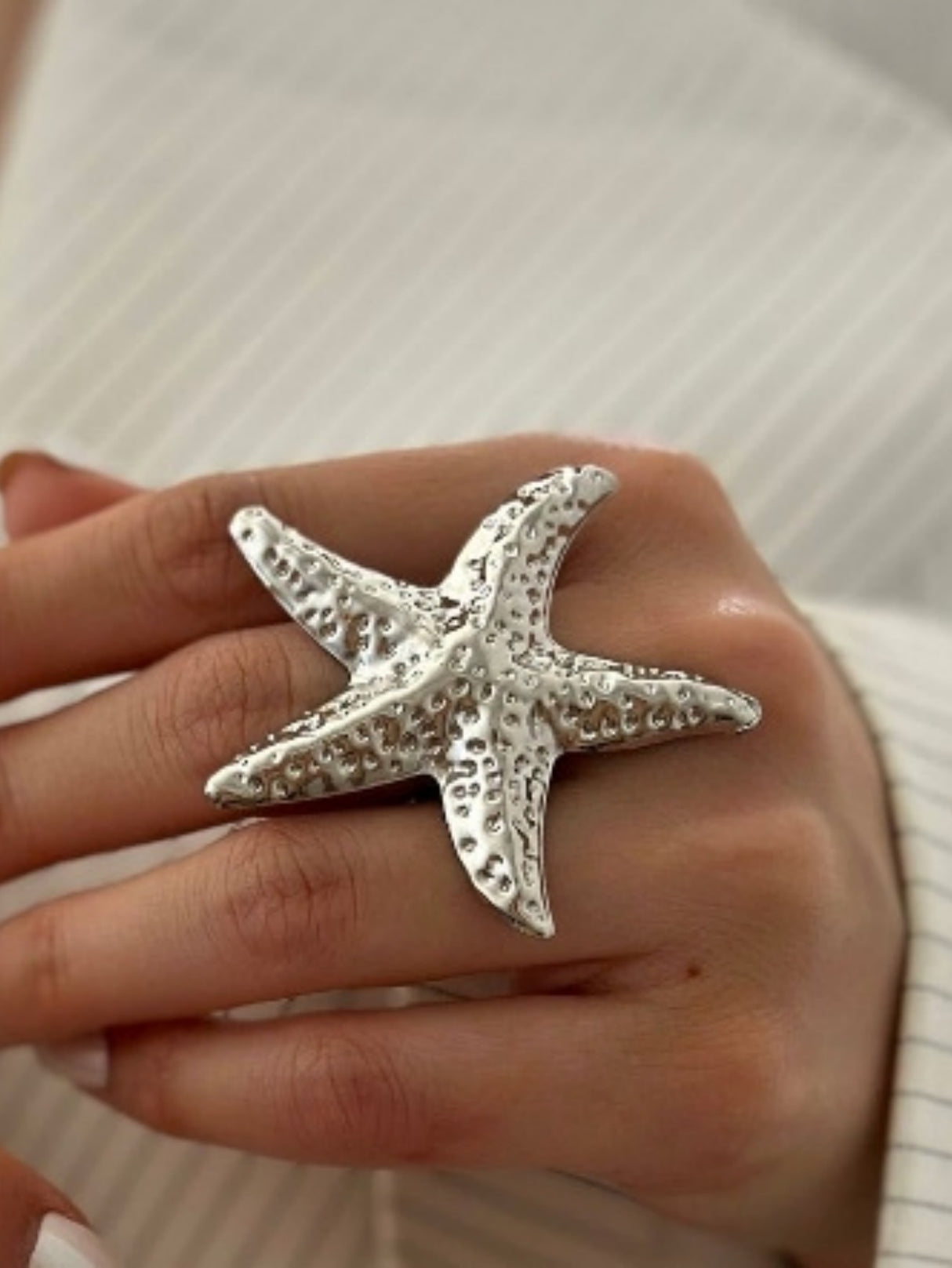A Ring With An Exaggerated Design Inspired By Conch Shells And Starfish.