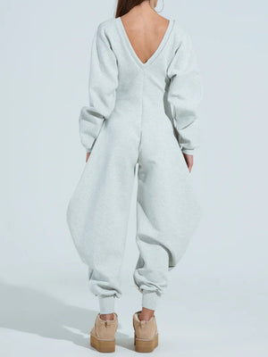 Ausgestellte, enge Jumpsuits und Bodysuits mit V-Ausschnitt und langen Ärmeln