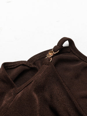 A Fitted Long-sleeved Top With A Flared Neckline And Metallic Shoulder Embellishments.