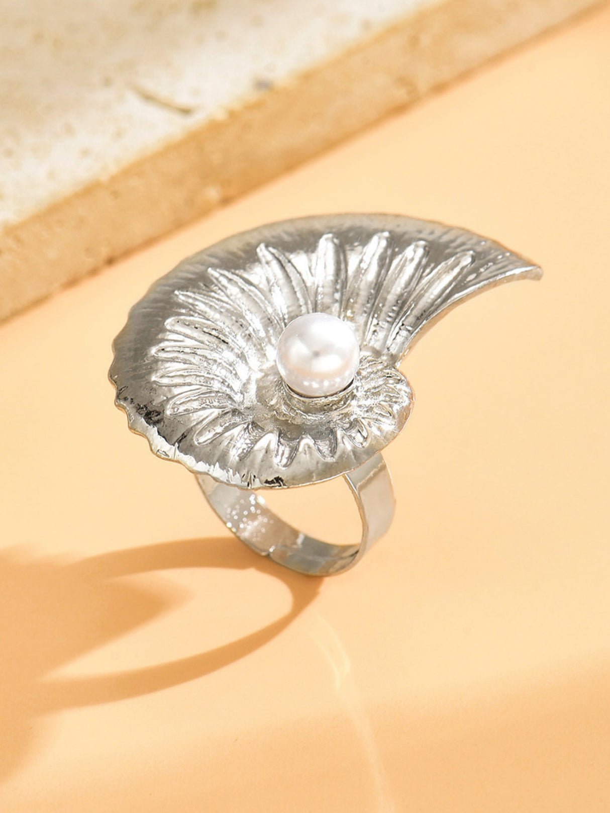 A Ring With An Exaggerated Design Inspired By Conch Shells And Starfish.