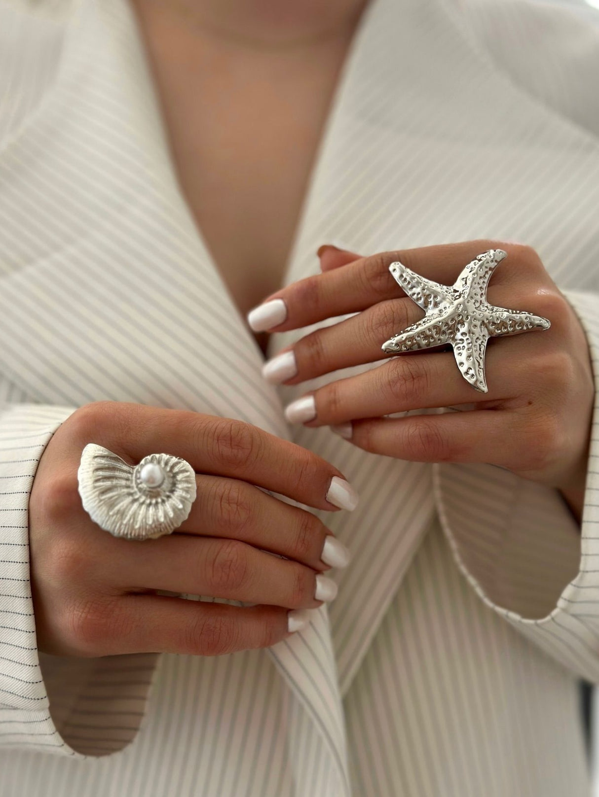 A Ring With An Exaggerated Design Inspired By Conch Shells And Starfish.